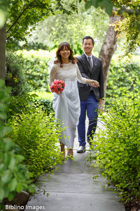 Happy couple leaving the wedding chapel