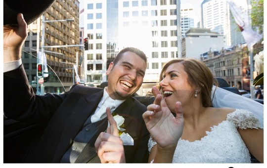 Bride-groom-sing-out-loud-while-driving-through-the-sydney-CBD-in-a-converable-limo